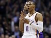 Oklahoma City Thunder guard Russell Westbrook gestures after hitting a 3-point shot to end the first quarter of an NBA basketball game against the Los Angeles Lakers in Oklahoma City, Friday, Dec. 7, 2012. Lakers' Darius Morris is at rear (AP Photo/Sue Ogrocki)
