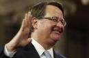 U.S. Senator Gary Peters smiles as he is ceremonially sworn-in by Vice President Joseph Biden in the Old Senate Chamber on Capitol Hill in Washington