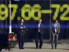 CORRECTS CURRENCY TO EURO AGAINST YEN - Passers-by are reflected on an electronic stock board displaying the euro's quotation against the Japanese yen at a securities firm in Tokyo, Tuesday, Jan 17, 2012. (AP Photo/Koji Sasahara)