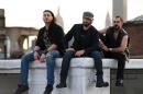 Members of the Iraqi heavy metal band Acrassicauda (L-R), guitarist Moe Al Hamawandi, drummer and lyricist Marwan Hussein and singer Faisal Mustafa, pose for a photo on the roof of Spin Recording Studios on April 30, 2015 in New York