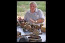 In this 2008 photo provided by the Turkana Basin Institute, paleoanthropologist Richard Leakey discusses the evidence for human evolution over a collection of hominin fossil casts at the Turkana Basin Institute's Ileret research facility in northern Kenya. Leakey predicts skepticism over evolution will soon be history sometime in the next 15 to 30 years. "If you get to the stage where you can persuade people on the evidence, that it's solid, that we are all African, that color is superficial, that stages of development of culture are all interactive," Leakey says, "then I think we have a chance of a world that will respond better to global challenges." (AP Photo/Turkana Basin Institute, Bob Campbell)
