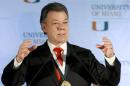 Colombia's President Juan Manuel Santos gestures as he addressed a gathering at the University of Miami in Coral Gables