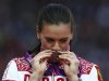 Russia's Yelena Isinbayeva kisses her bronze medal during the women's pole vault victory ceremony at the London 2012 Olympic Games