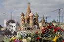 A portrait of Kremlin critic Nemtsov and flowers are pictured at the site where he was killed on February 27, with St. Basil's Cathedral seen in the background, at the Great Moskvoretsky Bridge in central Moscow