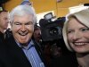 Republican presidential candidate, former House speaker Newt Gingrich, left, and wife, Callista, right, move through a crowded pub during a campaign stop, Sunday, Jan. 1, 2012, in Ames, Iowa. (AP Photo/Eric Gay)