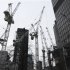 Cranes are seen on a construction site in The City of London
