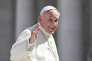 Pope Francis waves after his general audience in St Peter's square at the Vatican on September 18, 2013