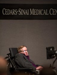 In this photo provided by Cedars-Sinai, British cosmologist Stephen Hawking, who has motor neuron disease, gives a talk titled "A Brief History of Mine," to workers at Cedars-Sinai Medical Center in Los Angeles, on Tuesday, April 9, 2013. (AP Photo/Cedars-Sinai, Eric Reed)