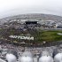 Crowds gather on the track before the start of the NASCAR Sprint Cup Series Daytona 500 race at the Daytona International Speedway in Daytona Beach