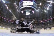Los Angeles Kings goalie Jonathan Quick (32) stops a shot on the goal in the second period during Game 4 of the NHL hockey Stanley Cup finals against the New Jersey Devils, Wednesday, June 6, 2012, in Los Angeles.  (AP Photo/Harry How, Pool)