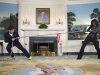 In this image released by The White House, first lady Michelle Obama participates in a tug of war with television host Jimmy Fallon in the Blue Room of the White House during a taping of "Late Night with Jimmy Fallon," for the second anniversary of the "Let's Move!" initiative on Jan 25, 2012, at the White House in Washington.  The segment is scheduled to air on Tuesday, Feb. 7, 2012. (AP Photo/The White House, Chuck Kennedy)
