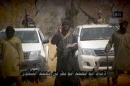 Boko Haram leader Abubakar Shekau (C) makes a statement in a video posted online on February 9, 2015