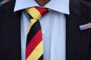 A man with a tie in German national colours wears a pin of the anti-immigrant Alternative for Deutschland (AfD) during the state election Mecklenburg-Vorpommern in Schwerin