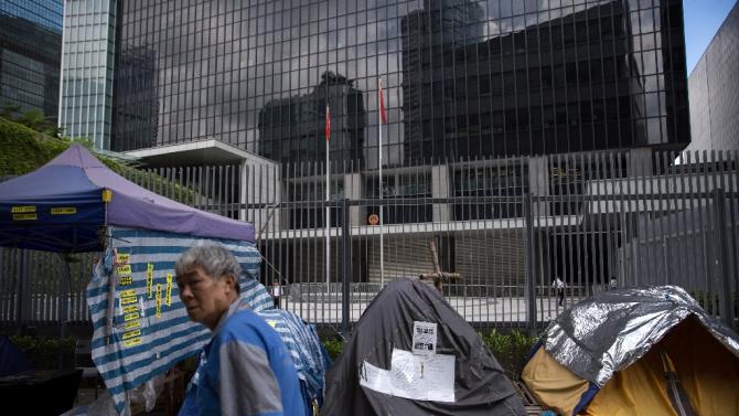 Hong Kong democracy groups take to streets as key vote looms.