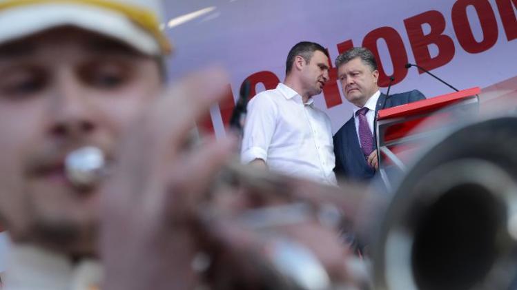 Ukrainian independent presidential candidate Petro Poroshenko (R) and Kiev mayoral candidate Vitali Klitschko (L) attend an election campaign rally on May 22, 2014, in the western Ukrainian city of Lviv