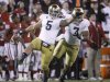 Notre Dame linebacker Manti Te'o (5)celebrates with teammate Stephon Tuitt (7) after an interception against Oklahoma in the fourth quarter of an NCAA college football game in Norman, Okla., Saturday, Oct. 27, 2012. (AP Photo/Sue Ogrocki)