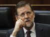 Spain's Prime Minister Mariano Rajoy talks with a party member, not seen, during a plenary session at the Spanish Parliament to approve the new conservative government's first batch of austerity measures, in Madrid, Wednesday, Jan. 11, 2012. Spain's Parliament approved the measures, including income and property tax hikes, aimed at reining in the country's swollen deficit with euro 8.9 billion ($11.5 billion) in spending cuts. (AP Photo/Daniel Ochoa de Olza)
