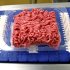 Ground beef is seen on a conveyor belt at the Fresh & Easy Neighborhood Market meat processing facility in Riverside