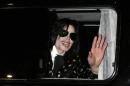 File photo of U.S. pop star Jackson waving to fans in Tokyo