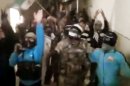 In this image made from amateur video and released by Ugarit News Wednesday, March 21, 2012, purports to show Syrian rebels chanting slogans in in Deir Al Zor 450 Kilometers (280 miles) northeast of Damascus, Syria. The Syrian uprising, which began one year ago, is transforming into an armed insurgency that many fear is pushing the country toward civil war. Because of Syria's close alliances with Iran and the Lebanese militant group Hezbollah, there are deep concerns that the violence could spread beyond the country's borders, especially if other nations arm the rebels or send in their own troops. (AP Photo/Ugarit News via APTN) THE ASSOCIATED PRESS CANNOT INDEPENDENTLY VERIFY THE CONTENT, DATE, LOCATION OR AUTHENTICITY OF THIS MATERIAL. TV OUT