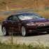 A Tesla Model S electric sedan is driven near the company's factory in Fremont