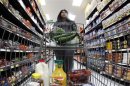 A shopper walks down an aisle in a newly opened Walmart Neighborhood Market in Chicago