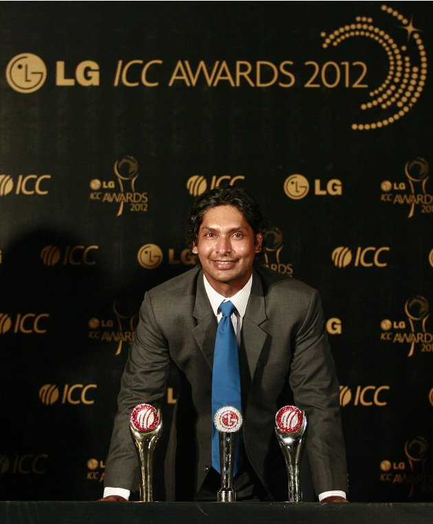 Sri Lanka's Sangakkara poses with his trophies during the ICC Awards in Colombo