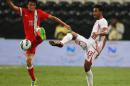 Hong Kong's Leung Chun Pong (L) fights for the ball with UAE's Khamis Esmaeel Khamis Zayed during their AFC Asian Cup 2015 qualifier football match at the Mohammed bin Zayed Stadium in Abu Dhabi, on November 15, 2013