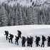 FILE -- Snowshoers head out on a trek at the Paradise area of Mount Raininer National Park in this Jan. 7, 2012, file photo. As the search for four people on the slopes of Mount Rainier stretches into its second week, experts say the rewards for the hearty few who attempt the summit of the 14,411-foot heavily glaciated volcano in winter are great, as are the dangers. (AP Photo/Elaine Thompson, File)