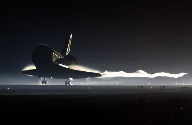 Space Shuttle Atlantis lands at the Kennedy Space Center at Cape Canaveral, Fla. Thursday, July 21, 2011. The landing of Atlantis marks the end of NASA's  30 year space shuttle program.  (AP Photo/Pie