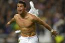 Real's Cristiano Ronaldo. takes off his shirt, at the end of the Champions League final soccer match between Atletico Madrid and Real Madrid, at the Luz stadium, in Lisbon, Portugal, Saturday, May 24, 2014. (AP Photo/Manu Fernandez)