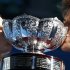 Jarmila Gajdosova and Matthew Ebden of Australia kiss the trophy after defeating Lucie Hradecka and Frantisek Cermak of Czech Republic in their mixed doubles final match at the Australian Open tennis tournament in Melbourne