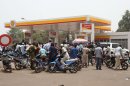 Moped drivers seeking petrol crowd a gas station, during fuel shortages following a military coup, in Bamako, Mali Saturday, March 24, 2012. Mali's U.S.-trained coup leader Amadou Sanogo said Saturday that he had no fears of a countercoup and no soldiers were protecting the ousted president Amadou Toumani Toure. (AP Photo/Aliou Sissoko)