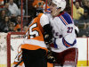 New York Rangers' Ryan McDonagh, right, reacts after scoring during the first period of an NHL hockey game against the Philadelphia Flyers, Tuesday, April 3, 2012, in Philadelphia. Flyers' Matt Carle, is at left. (AP Photo/Tom Mihalek)