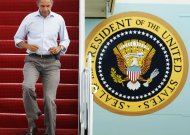 President Barack Obama jogs down the ramp of Air force One as he arrives at Andrews Air Force Base, Md., after a trip to New Jersey to tour Hurricane Irene damage, Sunday, Sept. 4, 2011.   (AP Photo/Manuel Balce Ceneta)
