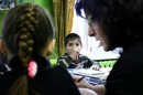 Orphan children attend a class at an orphanage in the southern Russian city of Rostov-on-Don