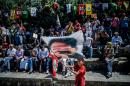 A boy waves a flag with a picture of the PKK's jailed leader Abdullah Ocalan at a rally in the Gazi district of Istanbul on July 23, 2016