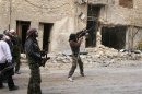 Free Syrian Army fighter aims his weapon to target a regime helicopter in Aleppo