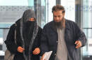 The parents of Mohammed Hamzah Khan, a 19-year-old U.S. citizen from Bolingbrook, Ill., leave the Dirksen federal building Monday, Oct. 6, 2014 in Chicago. Their son, Mohammed Hamzah Khan, was was arrested Saturday at O'Hare International Airport, from where he intended to travel to Turkey so that he could sneak into Syria to join the Islamic State group, according to criminal complaint released Monday. Khan is charged with attempting to provide material support to a foreign terrorist organization. A federal judge has ordered him held until a detention hearing Thursday. (AP Photo/Sun-Times Media, Al Podgorski) MANDATORY CREDIT, MAGS OUT, NO SALES