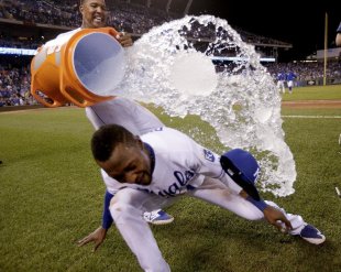 Salvador Perez (left) tries to douse Jarrod Dyson after the Royals' 3-1 victory over the Pirates. (AP)