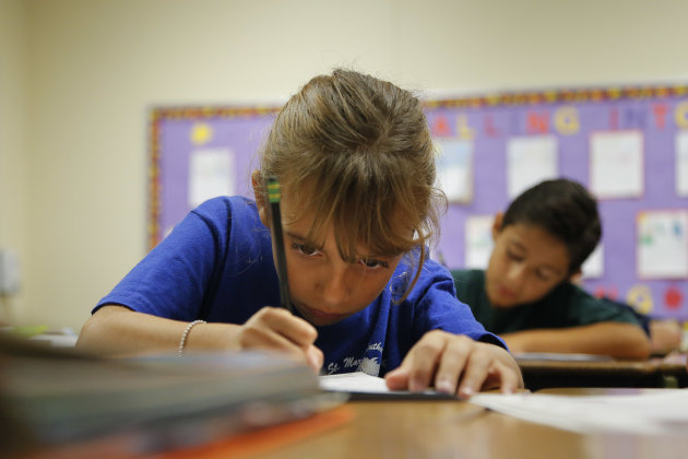 Alexia Herrera practices writing in cursive at St. Mark’s Lutheran School in Hacienda Heights, Calif., Thursday, Oct. 18, 2012. Bucking a growing trend of eliminating cursive from elementary school curriculums or making it optional, California is among the states keeping longhand as a third-grade staple. (AP Photo/Jae C. Hong)