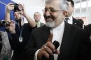 Iran's ambassador to the International Atomic Energy Agency, IAEA, Ali Asghar Soltanieh is surrounded by media when arriving for the IAEA board of governors meeting at the International Center, in Vienna, Austria, on Wednesday, March 7, 2012. (AP Photo/Ronald Zak)