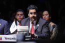 Venezuela's Vice President Nicolas Maduro reads a letter from Venezuela's President Hugo Chavez during a general meeting at the summit of the Community of Latin American and Caribbean States (CELAC) in Santiago