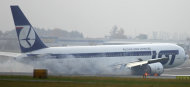 A Boeing 767 of Polish LOT airlines makes an emergency landing at Warsaw airport, Poland, Tuesday, Nov. 1, 2011. The plane was en route from Newark with 230 people on board but no one was injured. (AP Photo) POLAND OUT