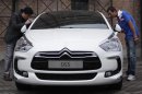 People view a Citroen DS5 ahead of the launch ceremony for mainland China market in Beijing