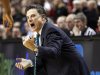 Louisville head coach Rick Pitino shouts to his team in the first half of an NCAA college basketball tournament third-round game with New Mexico, in Portland, Ore., Saturday, March 17, 2012. (AP Photo/Rick Bowmer)