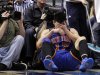 FILE - In this March 6, 2012, file photo, New York Knicks' Jeremy Lin reacts after being fouled during an NBA basketball game against the Dallas Mavericks in Dallas. Lin is having left knee surgery and will miss six weeks, likely ending his amazing breakthrough season.  The team said Saturday, March 31, 2012, the point guard had an MRI exam this week that revealed a small, chronic meniscus tear.   (AP Photo/Tony Gutierrez, File)