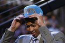 NBA prospect Davis from the University of Kentucky tries on his cap after being selected by the Hornets as the first overall pick in the 2012 NBA Draft in Newark