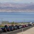 FILE - In this April 10, 2011 file photo, traffic backs up heading southbound toward Lake Mead on U.S. Highway 93 in Boulder City, Nev. The Hoover Dam, one of the world's great engineering feats, is marred by roads with traffic so jammed along the Nevada-Arizona border that it tells a different story about the political will to maintain 21st century infrastructure. The road leading to the dam cannot accommodate the torrent of tourists and spills them into the overwhelmed little town of Boulder City. Nevada lawmakers are trying to find a private company to build a $400 million bypass because the state cannot afford it. (AP Photo/Julie Jacobson, File)