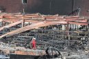 A fireman walks through the wreckage of the downtown core in the town of Lac-Megantic, Quebec